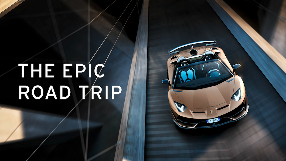 A Rust-Colored Lamborghini Aventador Drives On A Road In A Promotional Image With Text Reading &Quot;The Epic Road Trip&Quot; Next To It.