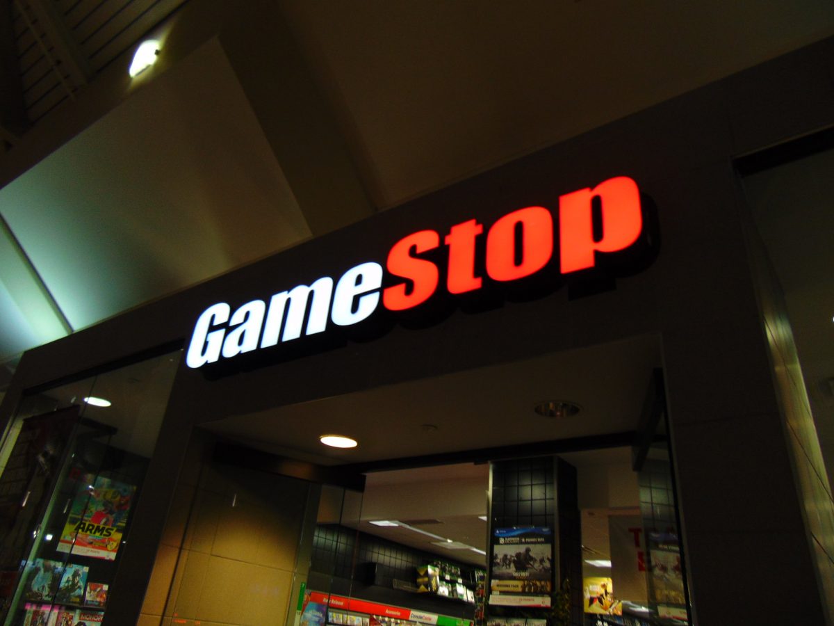 A nighttime shot of the exterior of a GameStop branch.