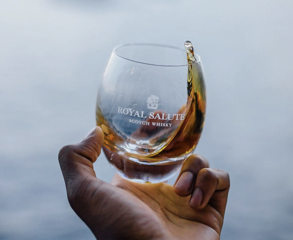Glass of whiskey with royal salute logo