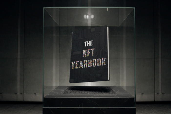 The NFT Yearbook in a display case