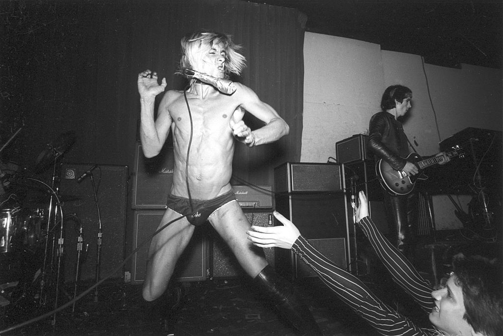 Iggy Pop performs on stage with the Stooges at the Whiskey A Go Go, Los Angeles, California, October 1973. At right is guitarist James Williamson.