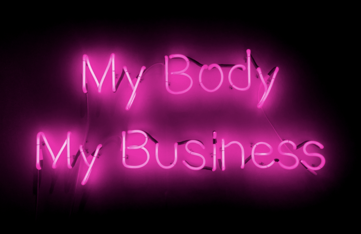neon sign that reads "my body my business"