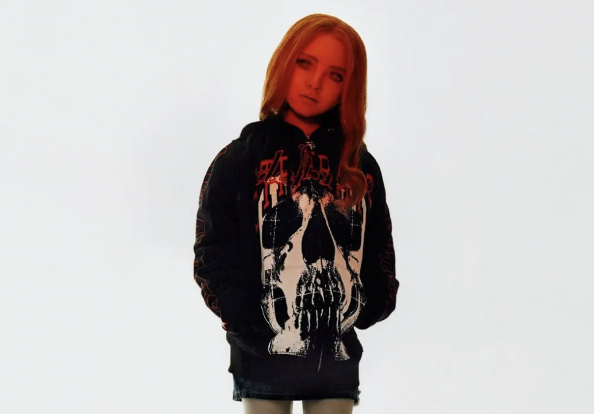 An image of M3gan in a black hoodie fromHeaven by Marc Jacobs