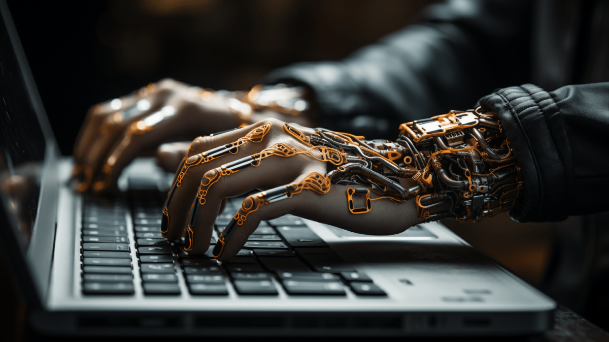 An AI-generated image of a pair of hands that are half human and half robotic typing at a laptop.